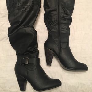 Tall black heeled boots